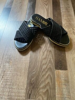 Sam & Libby Black Perforated Crisscross Slide Sandals with Gold Logo